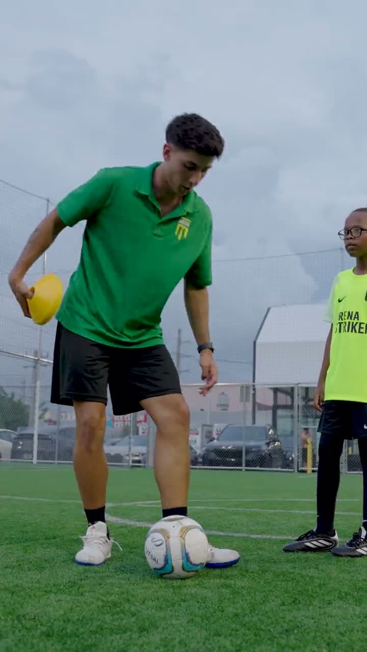 Arena Strikers coaches and young players training on the turf field at Arena SSC Wynwood, Miami